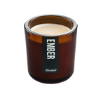 Hemlock Campfire Candle in amber glass jar, front label reading Ember, showing wax and wick