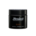 Hemlock hair clay 2 oz matte strong-hold styling clay jar, front label with Hemlock Grooming Supply logo