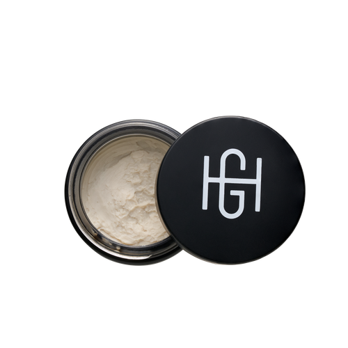 Hemlock hair clay 2 oz open jar showing clay texture with black HG logo lid