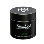 Hemlock hair paste 2 oz matte medium-hold styling paste jar, front label with HG logo lid.