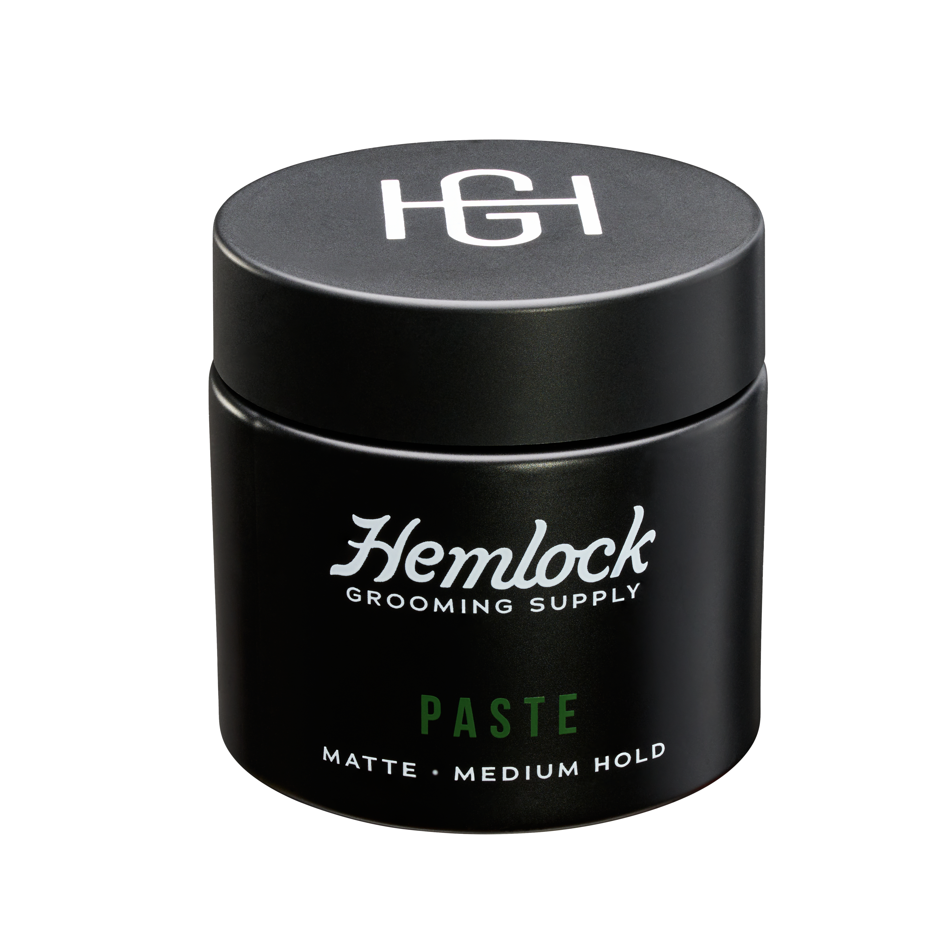 Hemlock hair paste 2 oz matte medium-hold styling paste jar, front label with HG logo lid.
