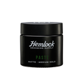 Hemlock Hair Paste 2 oz matte medium-hold styling paste jar, front label with Hemlock Grooming Supply logo